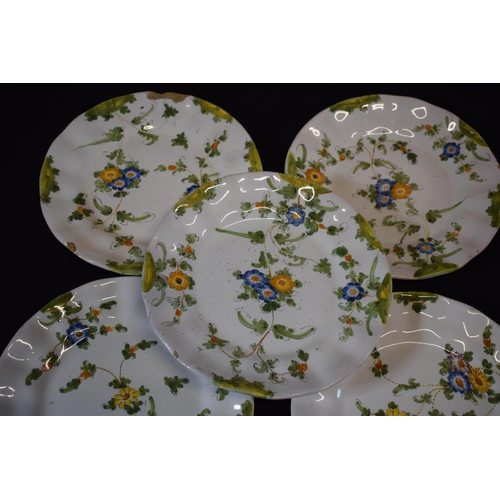 137 - A group of 5 18th century faience ware plates with floral designs and indistinct signature to rear (... 