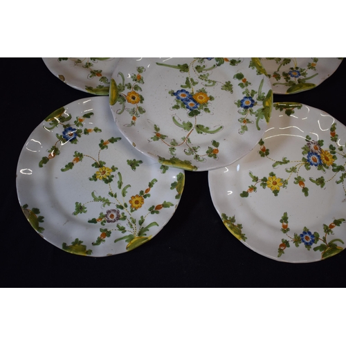 137 - A group of 5 18th century faience ware plates with floral designs and indistinct signature to rear (... 