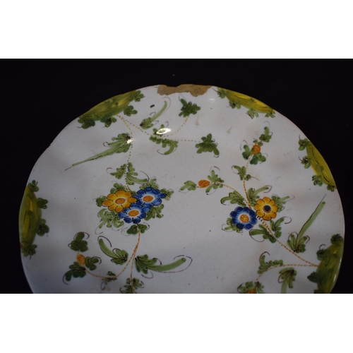 137 - A group of 5 18th century faience ware plates with floral designs and indistinct signature to rear (... 