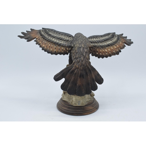 138 - Capo Di Monte realistic model of an Eagle / Bird of Prey landing on a rocky surface, 34cm wide.