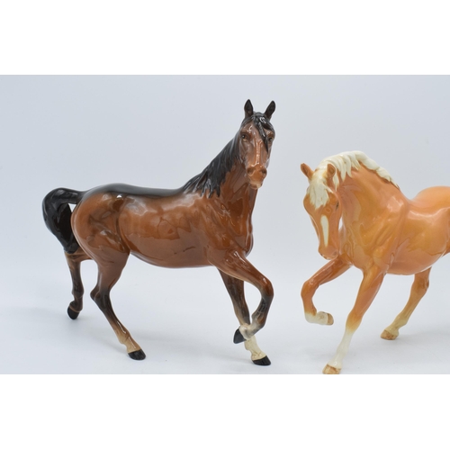 139 - Beswick Spirit of Freedom 2689, in gloss palomino colourway (ears af), together with brown gloss Spi... 