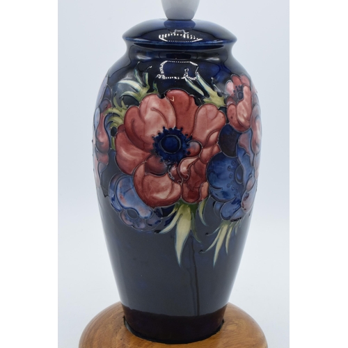 86 - Moorcroft pottery lampbase in the Clematis (or similar) floral pattern on turned wooden base, 28cm t... 