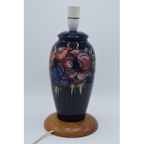 86 - Moorcroft pottery lampbase in the Clematis (or similar) floral pattern on turned wooden base, 28cm t... 