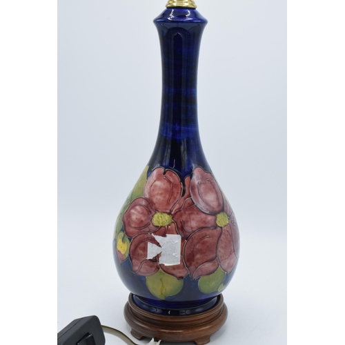 87 - Large Moorcroft unusual shaped pottery lampbase in the Hibiscus (or similar) floral pattern on turne... 