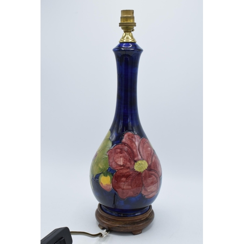 87 - Large Moorcroft unusual shaped pottery lampbase in the Hibiscus (or similar) floral pattern on turne... 