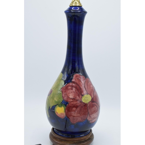 87 - Large Moorcroft unusual shaped pottery lampbase in the Hibiscus (or similar) floral pattern on turne... 