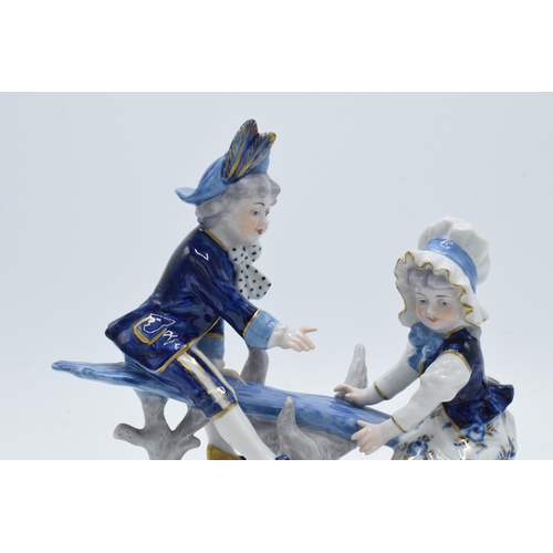 1 - Volkstedt Rudolstadt figure of a pair of children sat on a branch, 16cm tall.