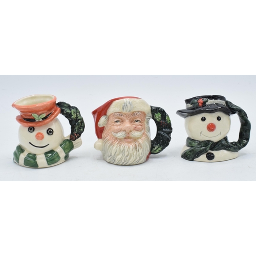 130 - A trio of miniature Royal Doulton character jugs to include Snowman D7062 (limited edition), Santa C... 