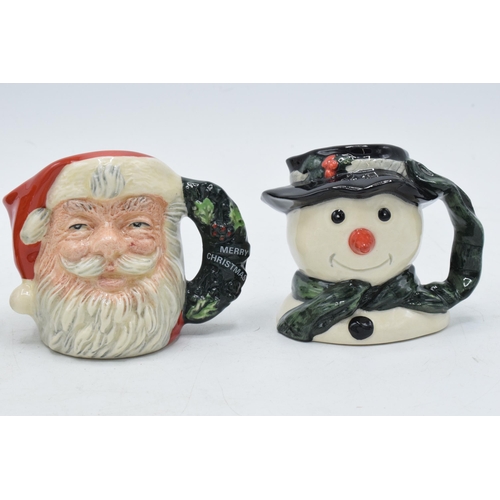 130 - A trio of miniature Royal Doulton character jugs to include Snowman D7062 (limited edition), Santa C... 