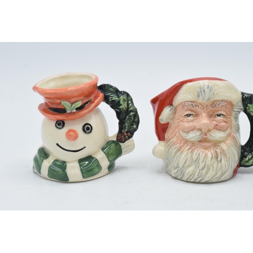 130 - A trio of miniature Royal Doulton character jugs to include Snowman D7062 (limited edition), Santa C... 