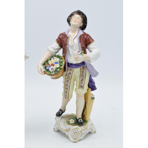 2 - A pair of Rudolf Kammer porcelain figures of flower carriers, height 23cm (2).