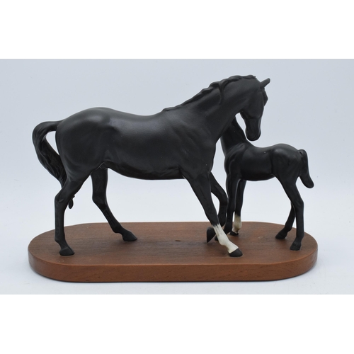 55 - Beswick Black Beauty and Foal on wooden base.