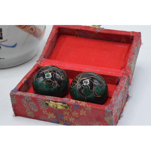 91 - An oriental low shouldered pot with traditional samurai scenes together with modern cased soapstone ... 