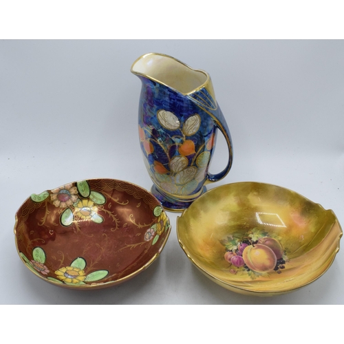 143 - Royal Winton items to include a floral lustre jug, a fruit scene bowl and a floral bowl (3).