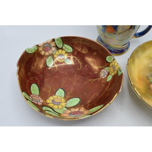 143 - Royal Winton items to include a floral lustre jug, a fruit scene bowl and a floral bowl (3).