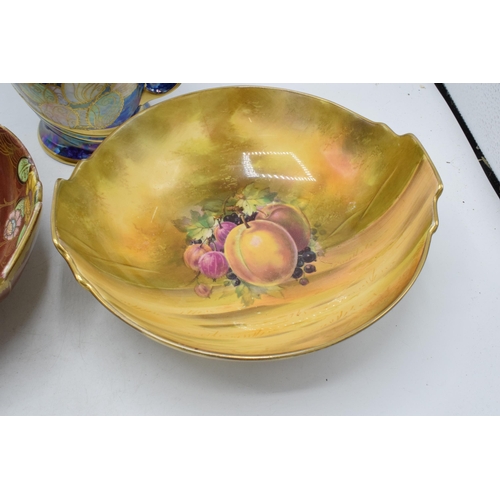 143 - Royal Winton items to include a floral lustre jug, a fruit scene bowl and a floral bowl (3).