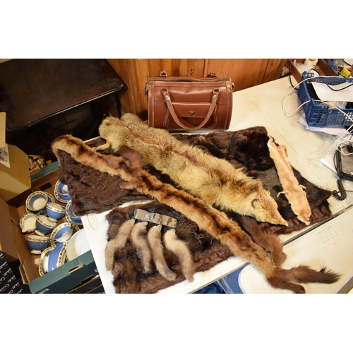 452C - A quantity of vintage furs, stoles and other items together with a vintage leather handbag.