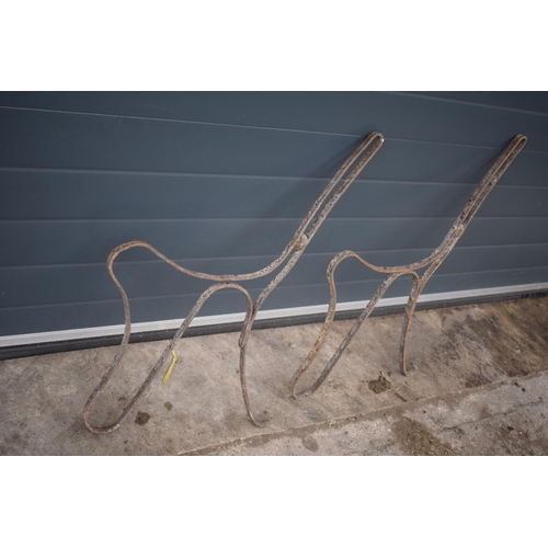 473 - A pair of late Victorian / Edwardian metal bench ends, 74cm tall (2).