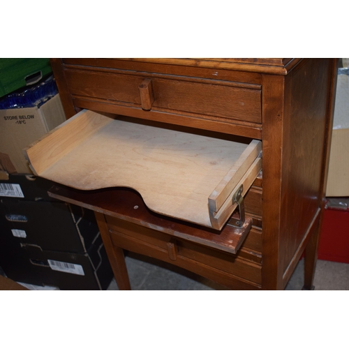 484 - Mid 20th century wooden music cabinet with pull out drawers and folding draw fronts with a box of sh... 