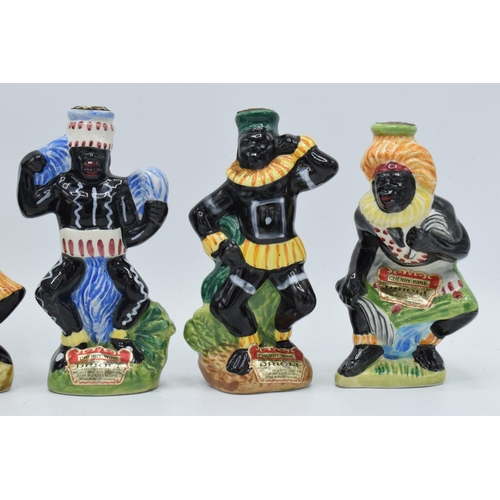 80 - A collection of Drioli novelty decanters to include African tribal figures (6 - all empty).