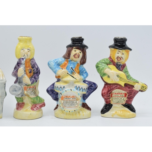 81 - A collection of Drioli novelty decanters in the form of a jazz band to include a piano player, a sax... 