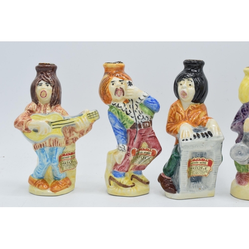 81 - A collection of Drioli novelty decanters in the form of a jazz band to include a piano player, a sax... 