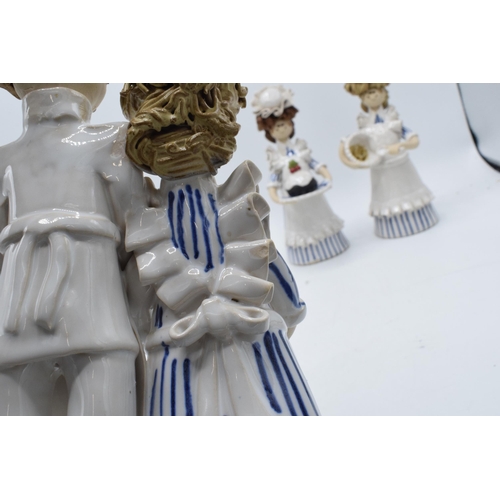 84 - A collection of Laura Dunn ceramic cooking figures to include a girl mixing, a couple with bread and... 