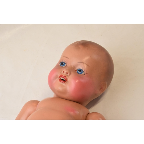 125 - An early to mid 20th century porcelain doll with hand-painted face. Marked to back of head '31 JAYCO... 