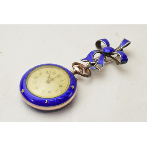 168L - Silver and blue enamel ladies fob watch with inlaid silver decoration with bow pin, in working order... 