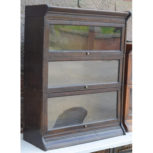 488 - Early 20th century three section barrister's bookcase with sliding doors with brass knobs, Globe Wer... 