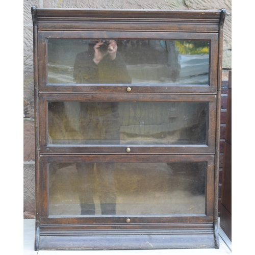 488 - Early 20th century three section barrister's bookcase with sliding doors with brass knobs, Globe Wer... 