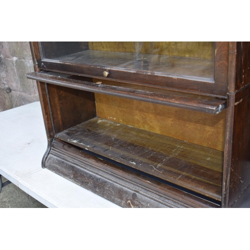 488 - Early 20th century three section barrister's bookcase with sliding doors with brass knobs, Globe Wer... 