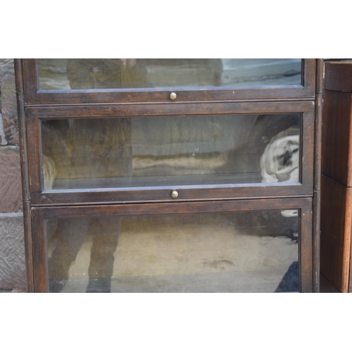 488 - Early 20th century three section barrister's bookcase with sliding doors with brass knobs, Globe Wer... 