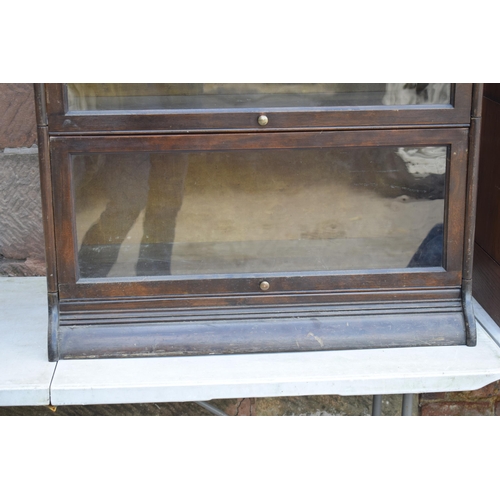 488 - Early 20th century three section barrister's bookcase with sliding doors with brass knobs, Globe Wer... 