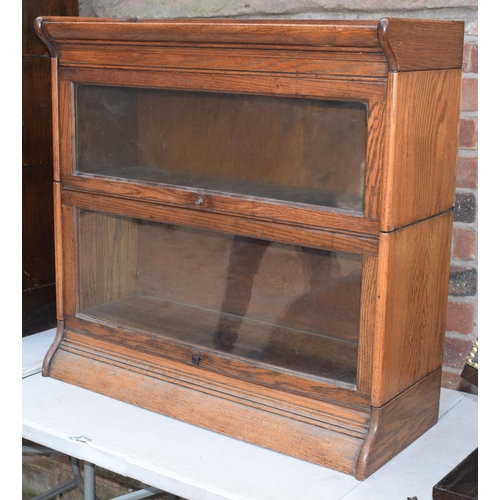 489 - Early 20th century golden oak two section barristers bookcase, Globe Wernicke company style, sliding... 