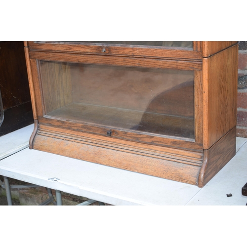 489 - Early 20th century golden oak two section barristers bookcase, Globe Wernicke company style, sliding... 