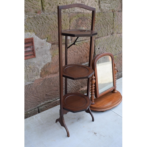 492 - A 3 tier folding plant stand together with a Victorian turned swinging loo mirror, 89cm tallest (2).