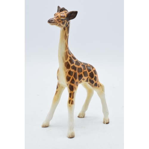 63 - A Beswick Giraffe marked Beswick England. Height 18cm.