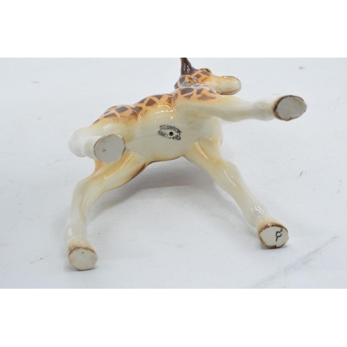 63 - A Beswick Giraffe marked Beswick England. Height 18cm.