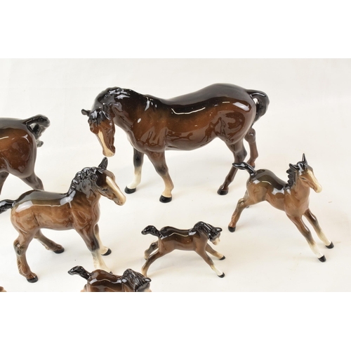 64 - A collection of Beswick brown horses. To include two standing large and seven fowls. (9)