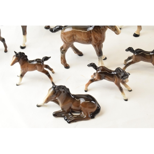 64 - A collection of Beswick brown horses. To include two standing large and seven fowls. (9)