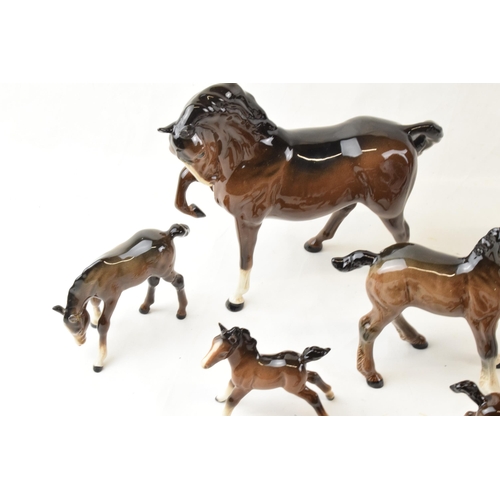 64 - A collection of Beswick brown horses. To include two standing large and seven fowls. (9)