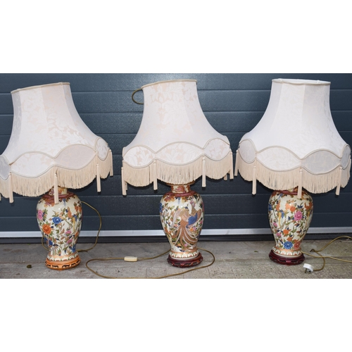 500 - A trio of modern oriental design ceramic lampbases with shades, 94cm tall inc fittings / shade (3).