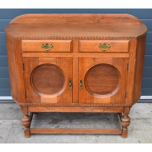 501 - 1930s Art Deco oak sideboard with shaped front, 122x45x99cm tall.