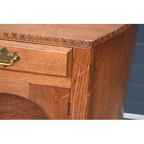 501 - 1930s Art Deco oak sideboard with shaped front, 122x45x99cm tall.