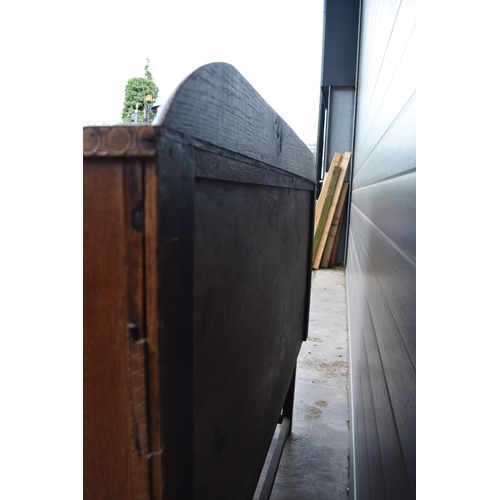 501 - 1930s Art Deco oak sideboard with shaped front, 122x45x99cm tall.