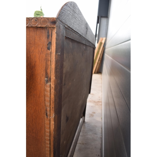 501 - 1930s Art Deco oak sideboard with shaped front, 122x45x99cm tall.