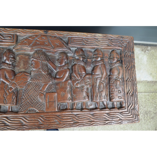 503 - Nigerian hard wood carved coffer / blanket box with carved figural decoration amongst traditional sc... 