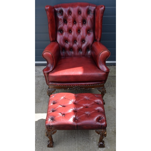 504 - Queen Anne revival chesterfield wingback armchair, in red leather with button back, raised on front ... 