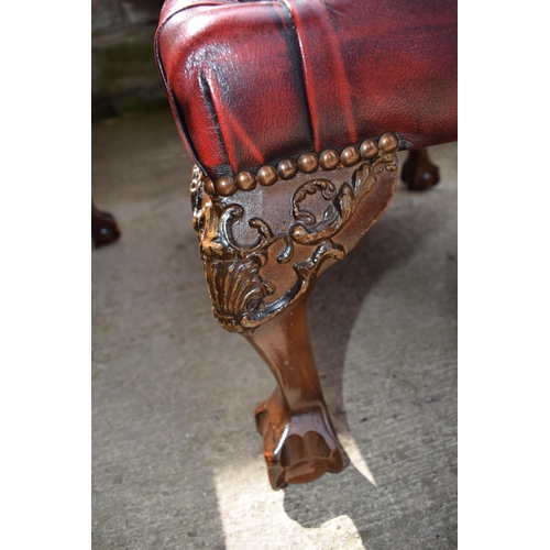 504 - Queen Anne revival chesterfield wingback armchair, in red leather with button back, raised on front ... 